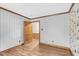 Spacious bedroom featuring wood trim and wallpapered walls at 3129 Tarheel Clubhouse Road Rd, Raleigh, NC 27604