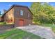 Charming home featuring a brick foundation, siding exterior, and convenient garage access at 3129 Tarheel Clubhouse Road Rd, Raleigh, NC 27604