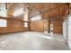 Spacious garage with wooden walls and large windows for natural lighting at 3129 Tarheel Clubhouse Road Rd, Raleigh, NC 27604