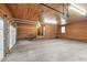 Large garage featuring wooden walls, brick foundation and a concrete floor at 3129 Tarheel Clubhouse Road Rd, Raleigh, NC 27604