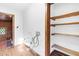 Laundry room featuring wooden shelving, connections for a washer and dryer, and wood trim at 3129 Tarheel Clubhouse Road Rd, Raleigh, NC 27604
