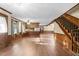 View of the Living Room with wood floors and staircase at 3129 Tarheel Clubhouse Road Rd, Raleigh, NC 27604