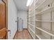 Pantry space with shelving and water heater at 3129 Tarheel Clubhouse Road Rd, Raleigh, NC 27604