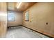 Functional room with concrete floor, wood walls and ceiling, windows to the outside at 3129 Tarheel Clubhouse Road Rd, Raleigh, NC 27604