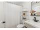 Bathroom featuring stylish fixtures, neutral tiling, and decorative accents at 3649 Guess Rd, Durham, NC 27705