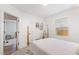 Bright bedroom with stylish decor, a four poster bed, and hardwood floors at 3649 Guess Rd, Durham, NC 27705