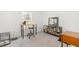 Bright bedroom with a window, desk, stool and bookcase at 3649 Guess Rd, Durham, NC 27705