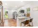 Modern kitchen with stainless steel appliances, granite countertops, and a breakfast bar with seating at 3649 Guess Rd, Durham, NC 27705