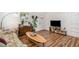 Bright living room features hardwood floors, natural light, and a comfortable seating area at 3649 Guess Rd, Durham, NC 27705