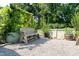 Backyard view of a bench, gravel, a white fence, plants, and trees at 365 Jorpaul Dr, Wake Forest, NC 27587
