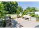 Backyard view with benches, gravel and decorative plants, and a white fence at 365 Jorpaul Dr, Wake Forest, NC 27587