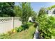 Image of the yard showing a garden, green grass, plants, and a white fence at 365 Jorpaul Dr, Wake Forest, NC 27587