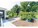 Lush backyard featuring gravel seating area and raised garden beds at 365 Jorpaul Dr, Wake Forest, NC 27587