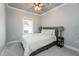 Serene bedroom with neutral tones, ceiling fan, and a large window at 365 Jorpaul Dr, Wake Forest, NC 27587