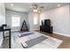 This is a bonus room with two windows, a ceiling fan, and hardwood floors at 365 Jorpaul Dr, Wake Forest, NC 27587