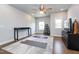 This is a bonus room with hardwood floors, two windows, and a ceiling fan at 365 Jorpaul Dr, Wake Forest, NC 27587