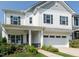 Charming two-story home with white siding, a covered porch, and a two-car garage at 365 Jorpaul Dr, Wake Forest, NC 27587