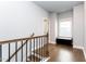 Upstairs hallway with hardwood floors, and a window bench for storage and extra light at 365 Jorpaul Dr, Wake Forest, NC 27587