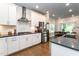 Modern kitchen with white cabinets, stainless steel appliances, and an island at 365 Jorpaul Dr, Wake Forest, NC 27587