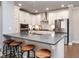 Modern kitchen features a large island with seating and stainless steel appliances at 365 Jorpaul Dr, Wake Forest, NC 27587