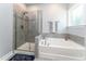 A main bathroom shows off a glass shower and soaking tub at 365 Jorpaul Dr, Wake Forest, NC 27587