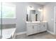 A main bathroom features double sinks, and a soaking tub at 365 Jorpaul Dr, Wake Forest, NC 27587
