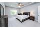 This is a spacious main bedroom with carpet, natural light, and a ceiling fan at 365 Jorpaul Dr, Wake Forest, NC 27587