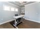 Spacious office with hardwood floors, white trim, and custom built-in shelving at 365 Jorpaul Dr, Wake Forest, NC 27587