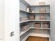 Organized walk-in pantry with shelving and storage baskets at 365 Jorpaul Dr, Wake Forest, NC 27587