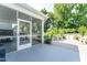 View from screened-in porch showing patio and lush backyard at 365 Jorpaul Dr, Wake Forest, NC 27587