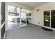 Inviting screened porch leading to an outdoor patio with hot tub and seating at 365 Jorpaul Dr, Wake Forest, NC 27587