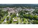 Discover the property's location, nestled among lush trees and greenery with the city visible from above at 408 N Fourth/ 4Th St, Mebane, NC 27302
