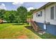 Charming home exterior with a wooden deck and a well-maintained yard at 408 N Fourth/ 4Th St, Mebane, NC 27302