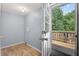 Laundry room with tile floors leading to a door to an outdoor wooden deck at 408 N Fourth/ 4Th St, Mebane, NC 27302