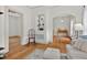 The living room with wood flooring, an arched doorway, and decor shelving at 408 N Fourth/ 4Th St, Mebane, NC 27302