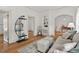 Cozy living room featuring hardwood floors, decorative shelving, and an open layout for easy entertaining at 408 N Fourth/ 4Th St, Mebane, NC 27302