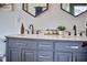 Bathroom featuring a stylish blue vanity with double sinks and modern fixtures at 418 Magna Dr, Durham, NC 27703