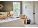 Inviting bedroom with bright window, chair, and cozy decor, creating a relaxing atmosphere at 418 Magna Dr, Durham, NC 27703