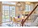 Cozy dining area with modern table, chairs, and a sliding glass door to the outdoor patio at 418 Magna Dr, Durham, NC 27703