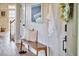Tastefully decorated entryway with a bench, decorative pillows, and wood floors, creating a warm and inviting ambiance at 418 Magna Dr, Durham, NC 27703