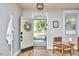 Bright entryway with an open door, stylish decor, and a view of the front yard, creating a welcoming atmosphere at 418 Magna Dr, Durham, NC 27703