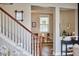Open entryway with hardwood floors leads into a cozy living space with ample natural light at 418 Magna Dr, Durham, NC 27703