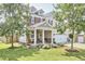 Attractive two-story home with landscaped yard, porch and a two-car garage at 418 Magna Dr, Durham, NC 27703