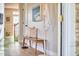Inviting hallway with wood flooring, a decorative bench, and an ocean-themed art piece at 418 Magna Dr, Durham, NC 27703