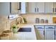 Close-up of a kitchen countertop with modern fixtures, neutral backsplash, and ample counter space at 418 Magna Dr, Durham, NC 27703