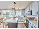 Spacious kitchen boasts stainless steel appliances, a large island, and ample counter space at 418 Magna Dr, Durham, NC 27703
