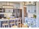 Updated kitchen with gray cabinets, stainless steel appliances, and an island with bar seating at 418 Magna Dr, Durham, NC 27703