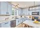 Stylish kitchen with modern appliances, quartz countertops, and ample cabinet space at 418 Magna Dr, Durham, NC 27703