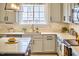 Well-lit kitchen featuring modern countertops, stainless steel appliances, and ample counter space at 418 Magna Dr, Durham, NC 27703