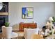 Cozy living area with fireplace, modern art, and a mid-century modern credenza at 418 Magna Dr, Durham, NC 27703